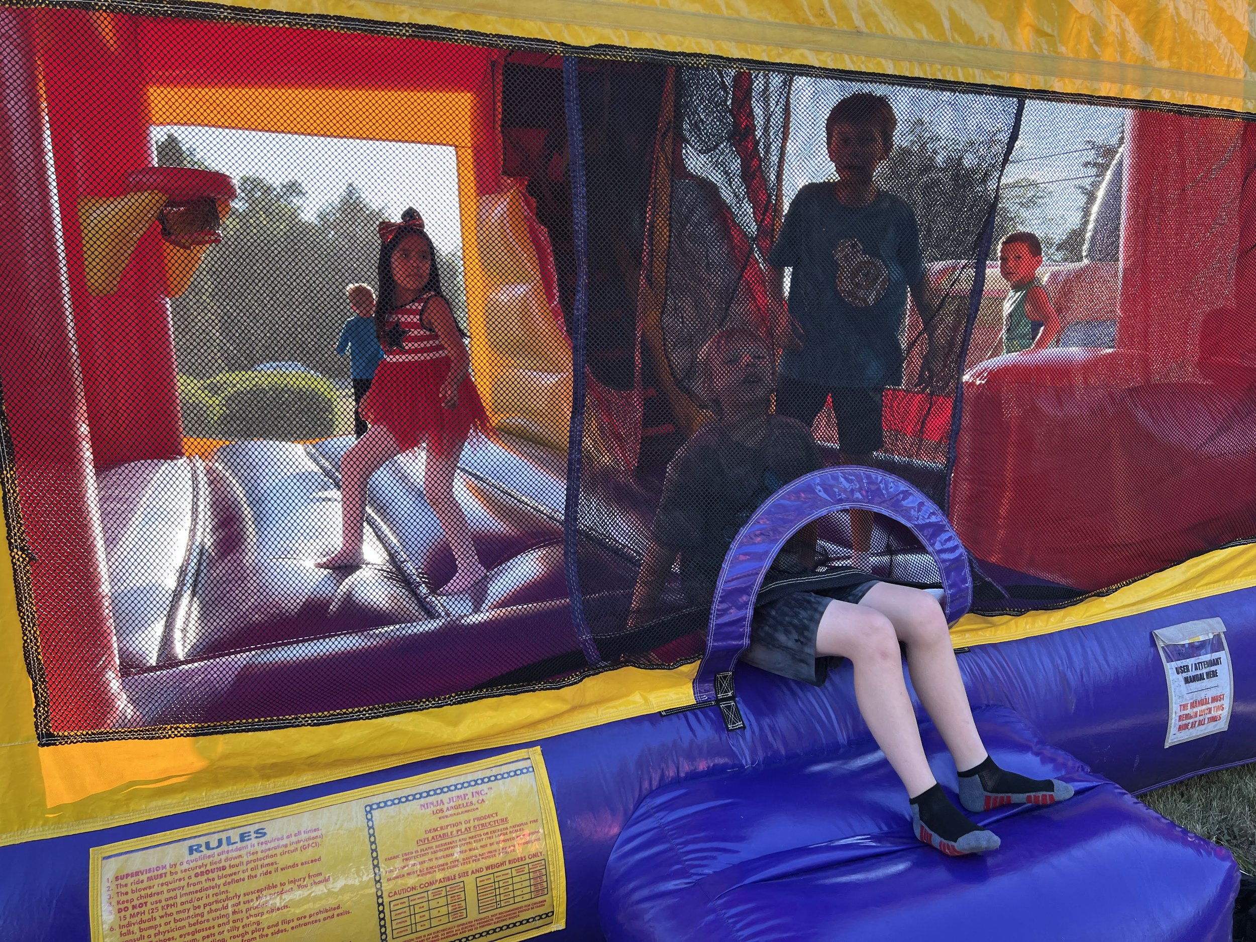 Children playing in a bounce house