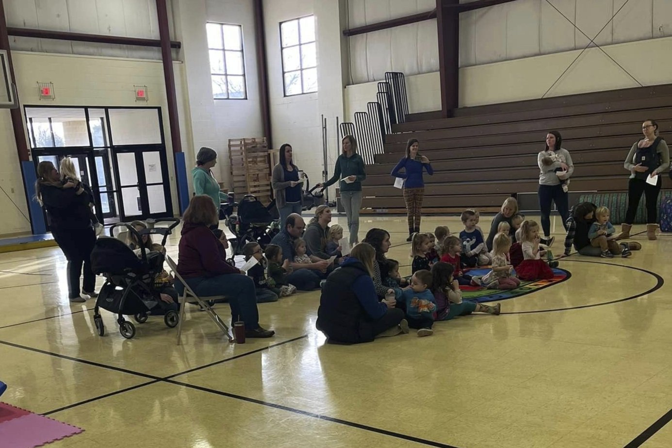 Parents and toddlers gathered in the gym for Toddler Open Gym